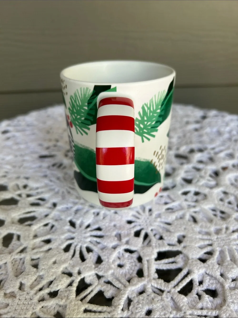 Starbucks White Mug with Green Leaf Motif and Red-White Striped Handle